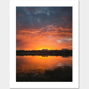 dramatic sunset sky reflecting on pond Posters and Art